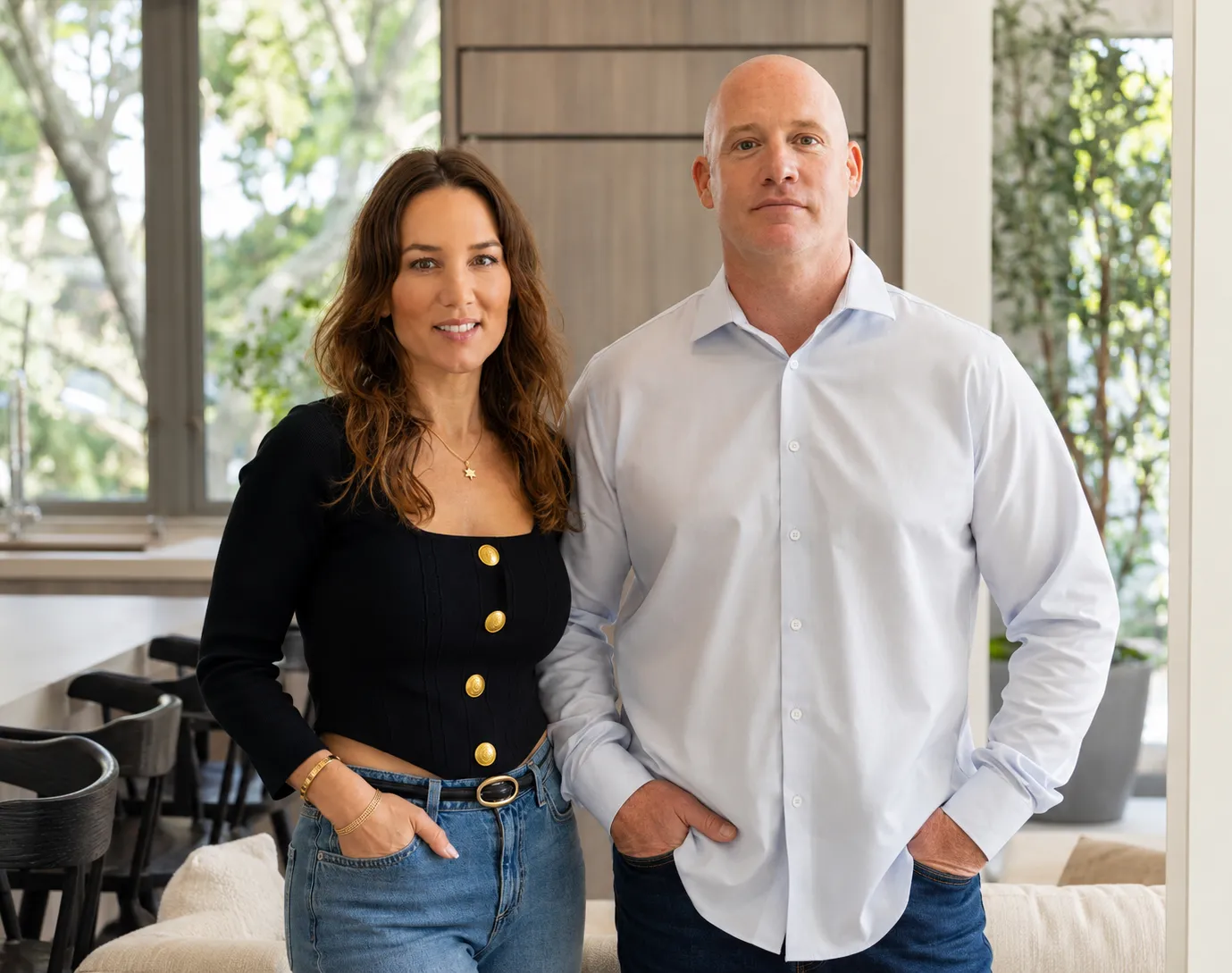 Michelle Yahav and Ami Gilad standing together indoors